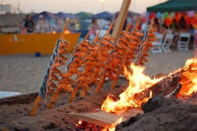 Fish Cooking On An Open Fire In Spain